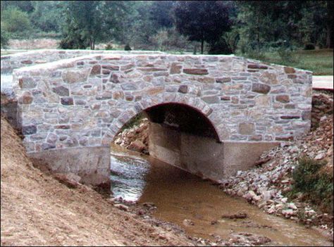 Moat (river/stream) with an elegant bridge over it. No need for Driveway Culvert, Backyard Bridges, Stone Driveway, Driveway Entrance, Driveway Design, Driveway Landscaping, Hillside Landscaping, Stone Bridge, Bridge Design