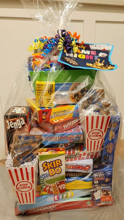 Themed Basket For Raffle, Board Games Basket Ideas, Diy Family Game Night Gift Basket, Game Night Silent Auction Basket, Family Game Gift Basket Ideas, Gift Baskets To Raffle Off, Team Building Prizes Gift Ideas, Family Game Night Auction Basket, Family Game Night Raffle Basket