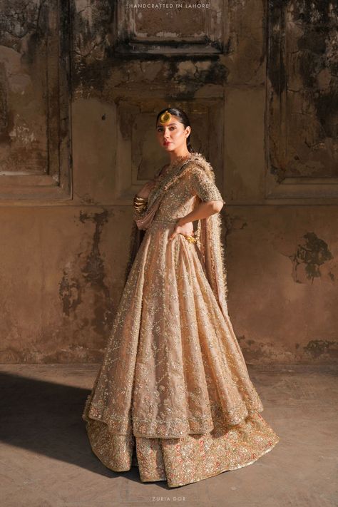 A dusty pink bridal meticulously adorned with thread work, zardozi, gotta, sequins, and mokaish. The bridal comprises a flared peshwas shirt matched with a lavishly embellished lehenga. Paired with a handcrafted dupatta with heavily embellished borders featuring a mokaish and motif spray, all elegantly finished with kiran edging. Embellished Lehenga, Formal Shawl, Nikah Dress, Desi Wear, Formal Accessories, Bridal Shawl, Pakistani Bridal Dresses, Pink Bridal, Formal Dresses For Weddings