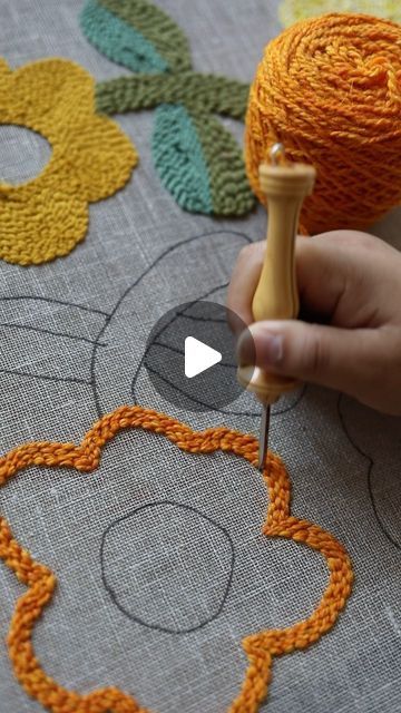 Arounna Khounnoraj on Instagram: "Creating a pillow with just the motif punched. I’m working on loose weave linen and using a no. 9 fine and regular. For the centre of the flower I pinched the loops so that they would be longer and I snipped the loops to get a tufted look 🤩🧡
I’ll show you tomorrow the finished #punchneedle piece
#rughooking #tufting" Punch Pillow, A Pillow, Weaving, Pillows, Flowers, On Instagram, Instagram