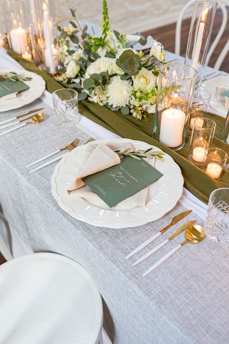 Table Set Up With Candles, Champagne And Green Table Setting, White Green And Gold Table Decor, Sage And White Table Decor, Wedding Tealight Candles, Pillar Candle Table Setting, Table Decorations White And Green, Light Green Gold And White Wedding, Glass Cylinder Centerpieces Wedding Long Table