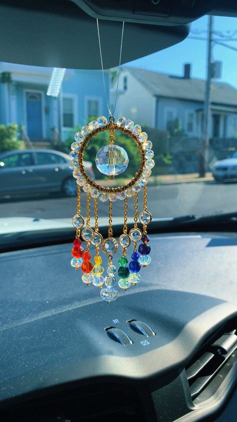 Decorate your space with this beautiful bright Rainbow Crystal  car charm sun catcher with beautiful crystal beads, and a crystal prism that reflects rainbows in direct sunlight. 🌞🌈 ✨Handmade with love! Add some positive energy to your car's rear view mirror or any small space like your kitchen or bathroom window. Perfect for tiny homes and van lifers too! Makes the perfect gift for anyone and everyone who loves all things that sparkle and shine!  ✨thank you for supporting my small business! I Van Lifers, Crystal Suncatchers Diy, Crystal Car Charms, Rainbow Car, Seed Bead Bracelets Tutorials, Car Charms Rear View Mirror, Diy Suncatchers, Dream Catcher Craft, Hanging Crystal