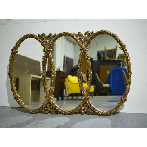 A spectacular large-scale Mid-Century Triple Oval Interlocking Acanthus Decorated Gold Wall Mirror boasting exquisite details. Made of resin, the gold frame is decorated with acanthus leaves and floral motifs. Ideal for a bar, restaurant, or hotel lobby. Ready to hang.   DIMENSIONS  Height 43, Width 66, Depth 2 inches  CONDITION NOTES  An excellent piece in perfect condition.    DELIVERY  Nationwide delivery or local FREE pick up in the Chicago area available. Gilded Mirror Decor, Mirror Panelling Wall, Mirror Panelling, Mirror Over Fireplace, Large Vintage Mirror, Wall Mantle, Large Oval Mirror, Gothic Mirror, Vintage Wall Mirror