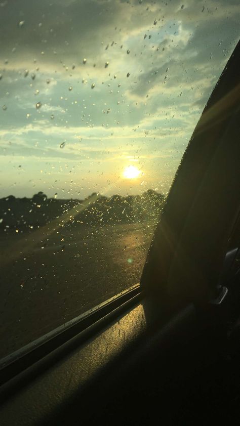 This picture takes place in a car window. On the window you can see rain droplets. In the sky you can see the sun shining surrounded by clouds. Rain On A Sunny Day, Sunshine In The Rain, Rainny Day, Sunny Rain, Rainy Mood, Rain Aesthetic, Story Background, Different Aesthetics, Sun Is Shining