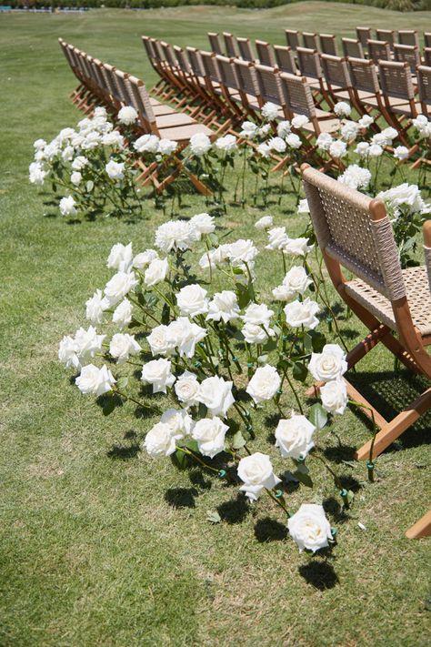 Classic Wedding Ceremony Decor, White Roses In Ground Wedding, Seating For Wedding Ceremony, Cobblestone Wedding Ceremony, Aisle Ground Flowers, White Roses Down Aisle, White Roses Down The Aisle, White Flowers Down Aisle, Beautiful Wedding Aisle