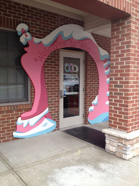 Dr. Seuss' Whoville arch decoration Whoville Archway, Whoville Christmas School Hallway, Whoville Christmas Yard Art, Whoville Hallway, Grinch Whoville, Grinch Party Decorations Diy, Whoville People, Wooden Whoville Christmas Tree, Diy Whoville Village