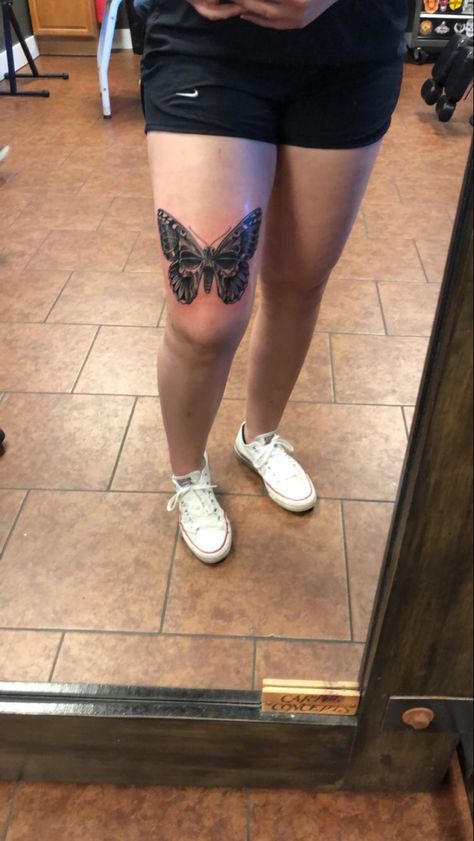 Butterfly thigh tattoo Over The Knee Butterfly Tattoo, Butterfly Tattoo With Skull Inside, Above Knee Tattoos Women Butterfly, Butterfly Tattoo Over Knee, Halloween Butterfly Tattoo, Butterfly On Thigh Tattoo, Big Butterfly Tattoo On Thigh, Butterfly Tattoo Shin, Butterfly Skull Tattoo For Women