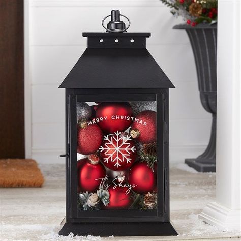 Personalize the lantern with your choice of engraved icon, holiday phrase and up to 2 lines of text Freestanding or features top loop for hanging Front door opens and closes securely with a latchMade of iron and glass; includes 4 glass panelsMeasures approximately 15.5"H x 8.25"L x 6"WWipe cleanCan be used outdoors or indoorsRecommended to move indoors during inclement weatherDecorative fillers and candles are not includedImported Create the perfect holiday ambiance with the Christmas Plaid Pers What To Put Inside Lanterns Decor, Candle Holder Christmas Decor, Decorate With Lanterns Indoors, Winter Lantern Centerpieces, Lantern Ideas Decorative, Decorate Lanterns Ideas, Candle Lanterns Decor Ideas, Decorated Lanterns Ideas, Lantern Christmas Decor Ideas