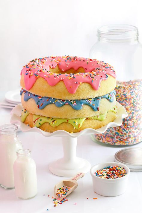 Could there be any more delightful dessert than a triple-stack donut cake?                                                                                                                                                     More Donuts Cake Design, Donut Cookie Cake, Donut Cake Ideas, Donut Cake Birthday, Insane Cakes, Donut Cakes, Torte Creative, Doughnut Party, Sommer Mad