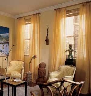 Ideas for Multiple Windows -- When space between windows is too narrow to use but too wide to simply cover up, curtains or drapes in a shade close to the color of the wall can both divide and blend the windows. The long, gold sheers on these windows accent the room's height while blending into the wall color. Curtains Over Blinds, Window Treatments Ideas, Window Curtains Living Room, Apartment Stuff, Window Treatments Living Room, Drapery Designs, Wall Colour, Bamboo Blinds, Window Covering