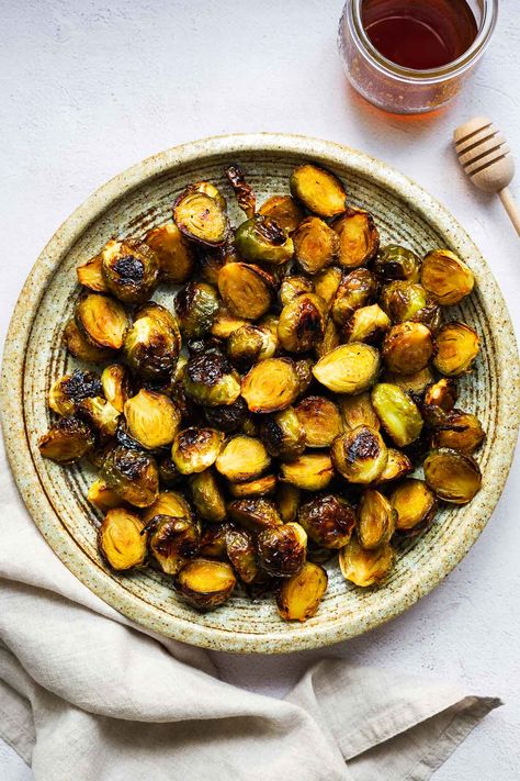 These hot honey-roasted Brussels sprouts are lightly sweet with a hint of heat from the spicy honey. The caramelised, crunchy edges provide textural contrast to the soft centres. It's a showstopping side dish for any occasion! Find the post Hot Honey Brussels Sprouts on Non-Guilty Pleasures. Deep Fried Brussel Sprouts, Fried Brussel Sprouts, Brussel Sprout Recipes Roasted, Roasted Sprouts, Sprouts Recipe, Flavorful Vegetables, Vegetable Side Dishes Recipes, Spicy Honey, Sprout Recipes