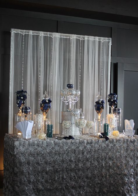 This is visually stunning but not accessible.  All the candy will still be in the jars at the end of the evening. Blue And Silver Dessert Table, Silver Dessert Table, Baby Shower Table Set Up, Blue Candy Buffet, Wedding Toms, Bar A Bonbon, Candy Buffet Wedding, Candy Buffet Tables, Candy Bar Wedding