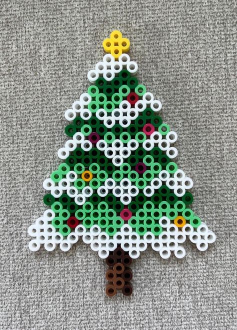 Christmas tree perler bead magnet made with white, green, mint, brown, yellow, red, pink and magenta beads. Christmas Hammer Beads, Perler Beads Holiday Patterns, Christmas Fuse Beads Ideas, Gingerbread Perler Beads, Christmas Tree Hama Beads, Hama Beads Christmas Tree, Christmas Melting Beads, Perler Bead Wind Chimes, Best Perler Bead Patterns