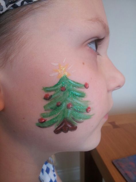 Christmas tree face paint Tree Face Paint, Face Painting Images, Easy Christmas Tree, Christmas Face Painting, Cheek Art, Wonder Land, Face Painting Easy, Kids Face Paint, Tree Faces