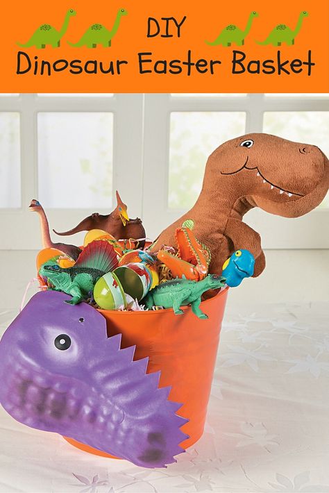 This Easter basket idea is dino-mite! Fueled by kids' love of dinosaurs, this DIY Easter basket is filled with prehistoric fun that'll make kids roar with delight! Lego Easter Basket, Dinosaur Easter Basket, Easter Craft Projects, Easter Arts And Crafts, Personalized Easter Basket, Basket Crafts, Easter Basket Diy, Easter Gift Baskets, Personalized Easter