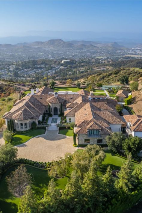 The California estate of Creedence Clearwater Revival frontman John Fogerty has hit the market for $19.995 million. Sitting on 22 acres in Thousand Oaks, California—about 40 minutes from downtown Los Angeles—the 18,600-square-foot Mediterranean-style mansion offers sweeping views of the mountains and the Pacific Ocean. The residence comes complete with two “epic” multi-million dollar soundproofed recording studios. California Illustration, California Mansion, Thousand Oaks California, John Fogerty, Irvine California, Creedence Clearwater Revival, Rich Home, Recording Studios, Wine Wall