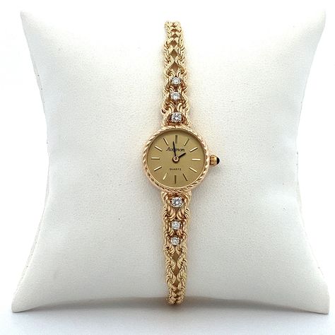 Gold bangle watch