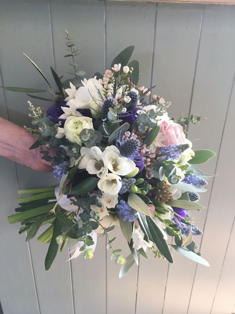 A february bouquet, in blues, whites and dusky pink. Featuring sea holly, paperwhites, grape hyacinths and roses, with Eucalyptus. Sea Holly Bouquet, Lily Of The Valley Bridal Bouquet, Dusky Blue Wedding, Cotton Candy Wedding, Bridal Wedding Flowers, Small Wedding Bouquets, Delphinium Flowers, Sea Holly, Winter Bouquet