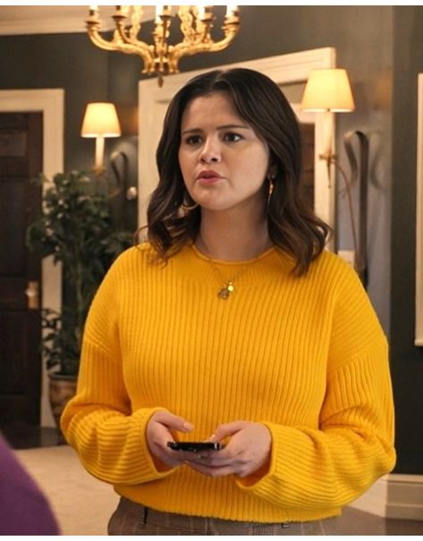 In Season 4 of “Only Murders in the Building,” Selena Gomez’s character, Mabel Mora, showcases her unique style and sharp wit while unraveling another captivating mystery.This Only Murders In The Building S04 Selena Gomez Yellow Knit Sweater is crafted from soft knit fabric, ensuring comfort and warmth. Only Murders In The Building Mabel Sweater, Mustard Yellow Sweater Outfit, Selena Gomez Yellow, Yellow Sweater Outfit, Mustard Yellow Sweater, Only Murders In The Building, Yellow Knit Sweater, Comfy Sweater, Yellow Knit