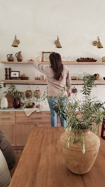 High Shelf Dining Room, How To Style Long Shelves, Long Floating Shelf Kitchen, Wood Shelves Dining Room, Dining Room Wall Shelving, Dining Floating Shelves, Natural Wood Floating Shelves Kitchen, Floating Shelf In Dining Room, Wall Shelves In Dining Room