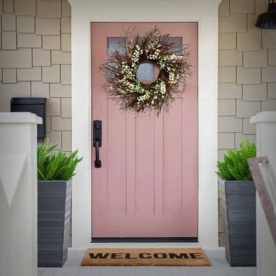 This wreath features a swirl of bristle twigs spiralling out from a woven branch ring base. It is decorated with white and cream-coloured forsythia flowers atop long flowing stems. A mixing of berry clusters and leafy greens add natural appeal and complimenting colours. Display this attractive decoration on doors, walls and windows in indoor or covered outdoor locations. Wreath Colour: Light Pink/White Forsythia Wreath, Cottage Front Doors, Pink Front Door, Nursery Furniture Collections, Front Door Paint Colors, Spring Light, Door Paint Colors, Pink Door, Pretty Wreath