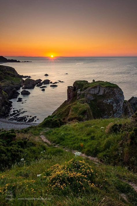 Sunset at Findlater Castle, Aberdeenshire Click to see full image Findlater Castle is the old seat of the Earls of Findlater and Seafield, sitting on a 50-foot (15 m)-high cliff overlooking the Moray Firth on the coast of Banff and Buchan, Aberdeenshire, Scotland. It lies about 15 km (9.3 mi) west of Banff, near the village of Sandend, between Cullen and Portsoy. Moray Scotland, Aberdeenshire Scotland, Disney World Trip, Warrior Cats, Rocky, Scotland, Disney World, Castle, Old Things