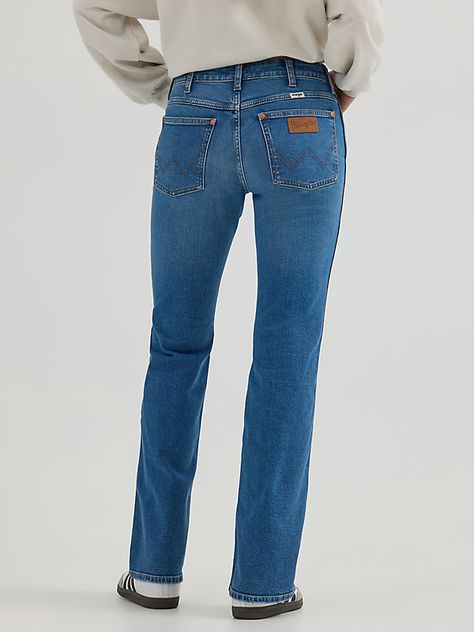 EXPAND YOUR HORIZONS Your favorite pair of jeans got a facelift. Our Women’s Westward Bootcut Jean comes with the same iconic fit that’s easy on the eyes, now in a new and flattering lower rise waist. It features a fitted seat, a slim leg from thigh to knee, and a dramatic leg opening that’s easy to style. Don’t worry, the heritage details are all still there: the five-pocket styling, our signature “W” stitching, and a logo patch. No matter where you’re headed, you'll feel right at home in this Denim Jacket Sherpa, Jean Shirt Dress, Mid Rise Bootcut Jeans, Wrangler Pants, Destructed Jeans, Work Jeans, Jeans Mid Rise, Bootcut Jean, Loose Fit Jeans