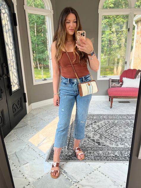 OOTD; obsessed with these sandals! Mom jeans, old navy jeans, cropped jeans, brown tank top, wardrobe basics, coastal cowgirl, western sandals, cow print, Tory Burch bag, mom outfit ideas, mom outfit, SAHM outfits, everyday outfits, simple outfits, everyday look, casual style outfit Follow my shop @heather_gal on the @shop.LTK app to shop this post and get my exclusive app-only content! #liketkit #LTKstyletip #LTKunder50 #LTKshoecrush @shop.ltk https://liketk.it/4ekGC Tank Top With Jeans Outfit, Tank Top With Jeans, Western Sandals, Outfit Ideas Mom, Sahm Outfits, Mom Outfit Ideas, Outfits Everyday, Brown Tank Top, Outfits Simple