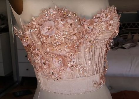 This tutorial will show you how to create a stunning custom DIY bustier top for that special wedding or elegant event.I'll guide you through the process of transforming a store-bought bustier into a one-of-a-kind piece using lace appliques or trims.Whether you want to match the wedding's color scheme, pay tribute to the bride, or simply stand out in style, this project is the perfect solution.With some basic sewing skills and creativity, you'll craft a DIY bustier outfit that looks tai… Diy Bustier Top, Diy Bustier, Bustier Outfit, Beaded Bustier, Simple Hand Embroidery Patterns, Basic Sewing, Sewing Skills, Bustier Top, Hand Embroidery Patterns