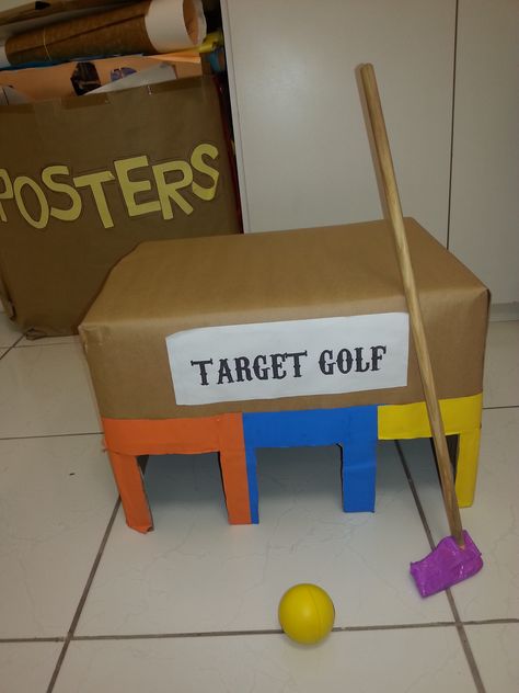 Target golf game made with a box and a squeegee (that I sawed and wraped with purple tape) Olympic Vbs, Target Golf, Vbs Olympics, Mouse Birthday, Mickey Mouse Birthday, Golf Game, 7th Birthday, Social Studies, Fun Games