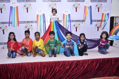 Colorful dazzling rainbow from the sky had been brought down in 'Brightland Play School' to celebrate 'Rainbow Day'with its tiny toddlers on 27th July, 2019.It was held to announce the onset of monsoon season and to conclude the concept of colors among the little ones. The little angels in colorful attire presented a vibrant show of dances, songs n skit. A beautiful rainbow 🌈, the Vibgyor was created & children spoke about colors. Childrens Day Celebration In School, Annual Day Theme For Preschool, Monsoon Day Celebration In School, Monsoon Art And Craft For Kids, Rainy Day Celebration In Preschool, Annual Day, Rainbow Dance, School Assemblies, Monsoon Season