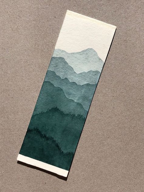 Original handpainted bookmark on cold press watercolor paper. Each bookmark is painted by hand so some variation may happen from the picture. Each bookmark is unique and sealed on the painted side with a protective finish. Bookmarks are around 2" x 6" and blank on the non-painted side, perfect for writing notes or quotes. Watercolor Mountain Bookmark, Masculine Bookmarks Diy, Bookmark Watercolor Painting, Water Colour Book Mark Ideas, Unique Watercolor Paintings Ideas, Bookmark Watercolor Ideas, Diy Bookmarks Watercolor, Watercolor Bookmarks Diy, Hand Painted Bookmarks