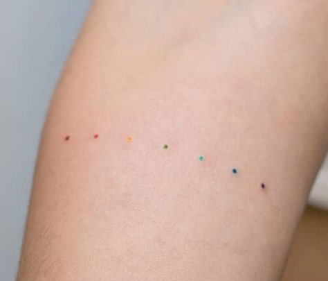 Pride Dots Tattoo, Rainbow Behind Ear Tattoo, Rainbow Ring Tattoo, Rainbow Circle Tattoo, Rainbow Dot Tattoo, Rainbow Dots Tattoo, Lgbtq Tattoos Ideas, Dot Tattoo Meaning, Stripe Tattoo