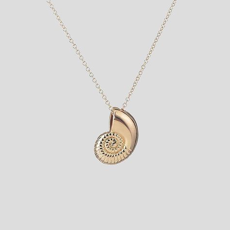 Sailor of the seas! Nautilus fossils -- relatives of octopuses and squids -- are mollusks and members of the cephalopod family. As they grow, they add new chambers to their shells, making them so unique. Become covered in the beautiful intricacy of the nautilus shell that is captured in this marine-inspired necklace! FINAL SALE - NO RETURNS OR EXCHANGES ALLOWED Product Specifications Nautilus fossil necklace Material: Alloy Color: Gold plated Chain Length: 18 inches Imported Nautilus Fossil, Nerdy Jewelry, Fossil Necklace, Shell Fossil, Ms Frizzle, Geeky Jewellery, The Nautilus, Nautilus Shell, Inspired Necklace