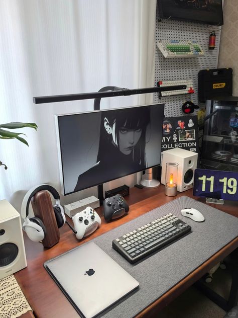 A minimalist gaming desk setup with a dark anime wallpaper on the monitor, mechanical keyboard, wireless mouse, gaming controllers, and a headphone stand. The setup balances monochrome design with clean organization Gaming Desk Setup, Best Gaming Setup, Setup Ideas, Gaming Desk, Cable Organizer, Desk Setup, Gaming Setup, Gaming Accessories, Level Up