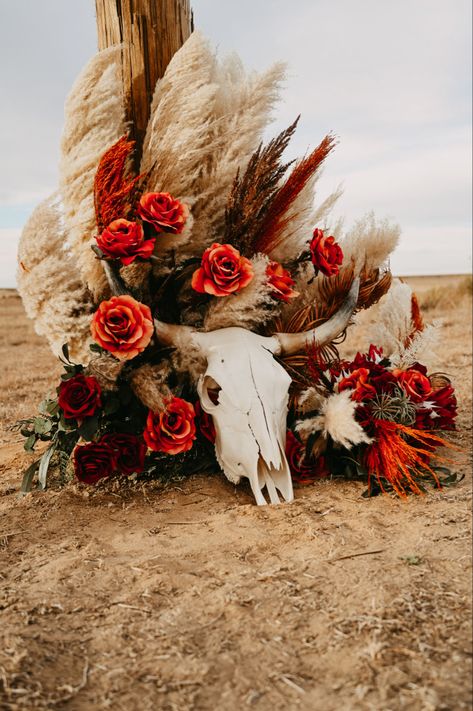 Western photography western wedding longhorn skull burnt orange florals pampas grass fake flowers Western Pampas Grass Decor, Western Wedding Burnt Orange, Fall Western Wedding Reception, Western Halloween Wedding, Bull Skull Wedding Decor, Red Western Wedding Theme, Orange Western Wedding, Western Isle Decorations, Cow Skull Wedding Decor