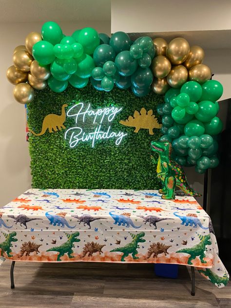 #dinosaurbirthdayparty #dinoparty #dinobirthday #dinosaurparty #dinosaurparty #dino #dinosaur #dinosaurdecorations #dinosaurpartydecorations #greenerywall #balloongarland #dinosaurballoon #happybirthdayneonsign #neonsign #birthdaybackdrop #kidsbirthdayparty #kidsbirthday #tworex #threerex #fourrex #fiverex #gold #green Dino Backdrop Birthday Party Ideas, Dino Party Ideas Decoration, Dinosaur Themed Birthday Party Backdrop, Dinosaur Backdrop Ideas, Dino Backdrop, Dinosaur Kids Party, Dino Party Decorations, Elsa Cake Frozen, Dinosaur Birthday Theme