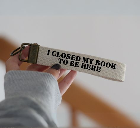 I Closed My Book To Be Here Key Fob - Reader Funny Gift For Book Lover - Heat pressed vinyl - Material : Cotton webbing - Approx. length Including hardware: 1 x 6 inch (can be longer if more names) - Production time: 1-3 business days - Made with lots of LOVE in Montreal,QC :) **Please note that the length of the keychain & colors may vary slightly from photos. Thank you for visiting LoveySlimey Shop, if you have any questions or request please contact us ❤ Gifts For Readers Book Lovers Unique, Presents For Bookworms, Gifts For Writer, Book Reader Quotes, Presents For Book Lovers, Reader Funny, Book Club Gift Ideas, Book Lover Gift Ideas, Gift Ideas For Book Lovers