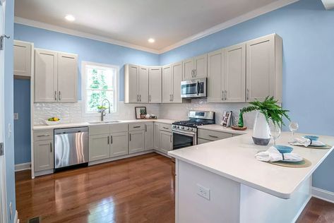 What Wall Color Goes With Gray Kitchen Cabinets? Wall Colors With Grey Cabinets, Kitchen Wall Colors With Grey Cabinets, Blue Walls Kitchen, Kitchen Grey Cabinets, Colors With Grey, Blue Kitchen Walls, Gray Kitchen Cabinets, Kitchen Grey, Kitchen Wall Colors