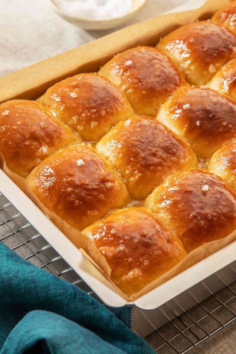 Butter up your family with a basket of these soft and pillowy dinner rolls. They rely on a smart trick called tangzhong to help them stay fresh for longer—if they last that long. #easysidedish #sidedish #sidedishfor #sidedishideas Honey Butter Rolls, Salted Honey Butter, Honey Dinner, Butter Rolls, Dinner Rolls Recipe, Dough Ingredients, Flaky Salt, Baked Bread, Honey Butter