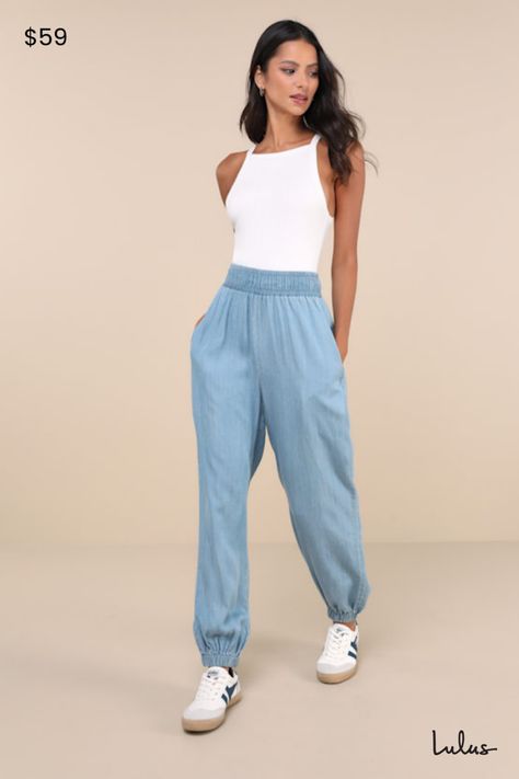 The Lulus Breezy Feeling Light Blue Chambray High-Rise Jogger Pants were made for those extra hot days when you want to stay cute and comfortable! These lightweight, jogger-style chambray pants feature a high, elasticized waistband and relax-fit pant legs with side seam pockets and elasticized, ankle-length hems. Pair with sandals and a cute white tee for a perfect summer look! Fit: This garment fits true to size. Length: Ankle length. Waist: Fitted - elastic waist allows stretch. Hip: Loosely F Blue Jogger Pants Outfit, Light Blue Joggers Outfit, Blue Joggers Outfit, Casual Mom Outfits, Jogger Pants Outfit, Chambray Pants, Modern Womens Fashion, Casual Outfits For Moms, Denim Jacket With Dress