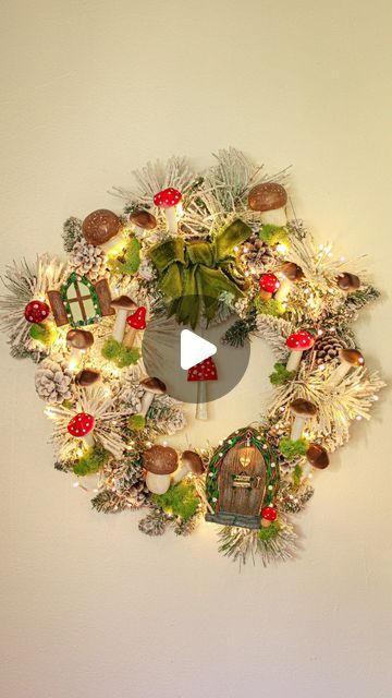 Must Love Herbs - Lauren May on Instagram: "A fairy garden wreath adorned with mushrooms, moss fairy lights and snow! Just in time for Yule and Christmas! There is even a sweet little fairy door with a working light! This was SO much fun to make! All you need are little mushroom figures, some moss, some hot glue, and your imagination! Did you spot the little key to the door? I hid it on the wreath! #fairygarden #hobbitdoor #mushroomart #faeriemagazine #mushroomcore #yule #yuletide #fairycore #christmas #mushies #hobbitcore #witchstagram" Mushroom Christmas Wreath, Fairy Garden Wreath, Fairycore Christmas, Moss Fairy, Love Herbs, Mushroom Core, Hobbit Door, Garden Wreath, Little Mushroom