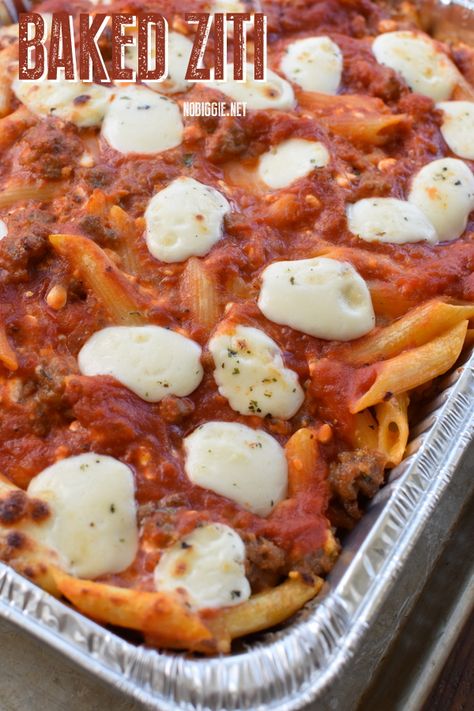 Baked Ziti with sausage for the ultimate Feed a Crowd dinner. Baked Ziti with Italian Sausage If you love the classic flavors of lasagna but all those layers can feel like more work than you are up for, make BAKED ZITI! It tastes just like lasagna and it's so easy! This is one of our favorite ways to feed a crowd. Add a big tossed salad and garlic bread, and dinner is served! This is also a great make ahead meal. Make it the night before and keep it covered in the fridge and bake it the next ... Feed A Crowd Dinner, Baked Ziti With Italian Sausage, Ziti With Sausage, Baked Ziti With Sausage, Baked Ziti Recipe, Italian Comfort Food, Baked Pasta, Tossed Salad, Cooking For A Crowd