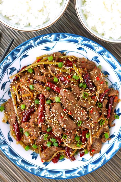 This Mongolian Lamb Stir-fry is quick and easy to make on any given weeknight and full of the BEST savory, spicy and sweet flavors! Tender lamb strips, shredded Welsh onion and fragrant aromatics get tossed in a tantalizing sauce that will tingle your tastebuds! #mongolianlamb #lambstirfry #dinner #easyrecipes #copycat #betterthantakeout #chinesefood #asianfood #stirfry #lamb | That Spicy Chick Lamb Stir Fry, Quick Stir Fry, Mongolian Lamb, Lamb Chops, Chinese Food, Stir Fry, Asian Recipes, Quick Easy, Dinner Recipes