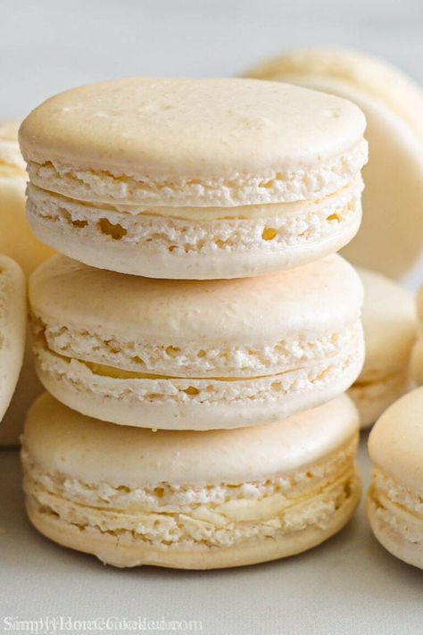 These Vanilla Macarons are light, airy, and delicious. This easy recipe will have you making these decadent sweet treats in no time! #macarons #vanillamacarons #vanillamacaron #vanillamacaronrecipe Eggnog Macarons, Vanilla Bean Macarons, Vanilla Ganache, Eggnog Dessert, Vanilla Macarons, Macarons Recipe, French Macaron, Buttercream Filling, Macaron Recipe