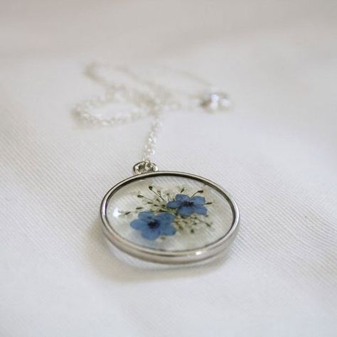 This Forget Me Not Necklace showcases delicate dried blue flowers. Expertly crafted with the finest materials, this necklace features a high-quality resin pendant that is durable and lightweight, ensuring maximum comfort during wear. The inclusion of dried blue flowers adds a touch of natural beauty and serves as a poignant reminder of the preciousness of life. This Necklace is a true testament to the values of brotherhood, loyalty, and fidelity at the heart of Masonic symbolism. They are perfec Forget Me Not Resin, Resin Material, Resin Pendant, Forget Me Not, Blue Flowers, Thoughtful Gifts, Natural Beauty, Pendant, High Quality