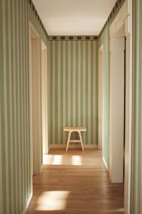 Koi Studio's new 'The Bold Stripe' wallpaper blends nostalgic vintage home decor with a contemporary twist. Make an impact with BelarteSTUDIO's exclusive interior design murals and create a unique and eclectic home online at belartestudio.com. Fun Hallway Wallpaper, Green And Pink Striped Wall, Striped Interior Design, Striped Wallpaper Entryway, Ceiling Stripes Paint, Green Striped Wall, Contemporary Eclectic Interior Design, Stripped Walls Ideas, Statement Wall Wallpaper