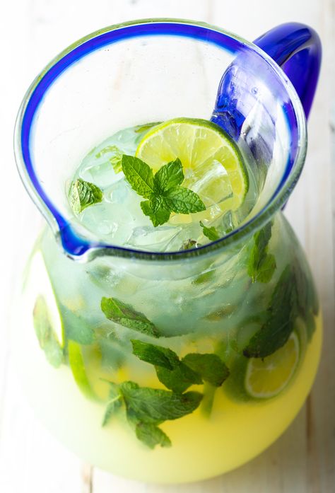 How to Make Perfect Mojitos by the Pitcher - Get the party started with a batch of refreshing mint Mojitos! This easy mojito recipe can be made virgin or with rum or vodka, and also includes steps for making homemade mint simple syrup. #mintmojitos #howtomakemojitos #mintsimplesyrup #rummojitos #vodkamojitos #virginmojitos #pitcherofmojitos #aspicyperspective Pitcher Of Mojito Recipe, Mojitos By The Pitcher, Easy Mojito, Mojito Recipe Pitcher, Mojito Pitcher, Easy Mojito Recipe, Vodka Mojito, Mojito Recipe Classic, Pineapple Mojito