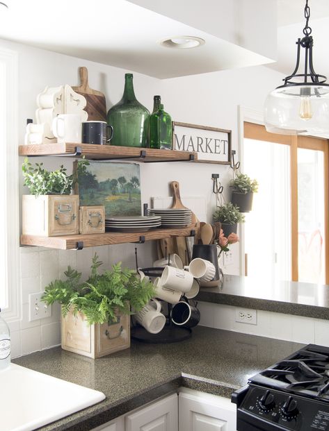 Open shelving for daily use is the new standard for modern kitchens. Learn simple and easy tips for how to decorate kitchen shelves no matter your style. #fromhousetohaven #kitchendecor #kitchenshelves #openshelving Decorate Kitchen Shelves, How To Decorate Kitchen Shelves, Floating Kitchen Shelves, Decorate Kitchen, Kitchen Open Shelves, Spring Kitchen Decor, Kitchen Shelf Decor, Farmhouse Shelves, Open Kitchen Shelves