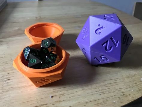 This is a large D20 shaped holder that unscrews so you can store dice in it. It is sized to hold a standard set of D&D Dice, but you may need to scale it up by 10-15% if you have more dice or larger than normal dice. Or, scale it down 10% for smaller dice.It prints well oriented with the threads at the top, but you may wish to turn on supports as some of the numbers have extreme overhangs The first time you assemble it, the threads might be tight, just work back and forth a bit until it loosen Dice Holder, Resin Printing, 3d Ideas, Witch Shop, 3d Printer Projects, 3d Printing Projects, Product Ideas, Print Inspiration, Tag Design